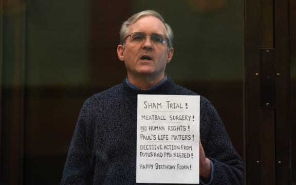 Paul Whelan, a former US marine accused of espionage and arrested in Russia in December 2018, stands inside a defendants' cage as he waits to hear his verdict in Moscow on 15 June 2020.