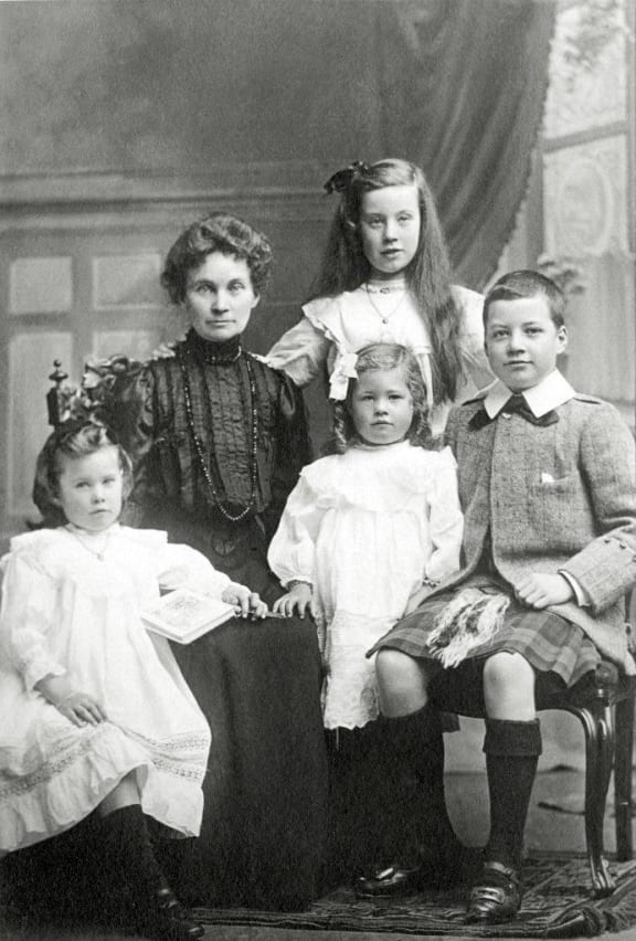 Marshall Walker's grandmother Isa with her children. Marshall's mother Nora is front centre and the boy is uncle Marshall.