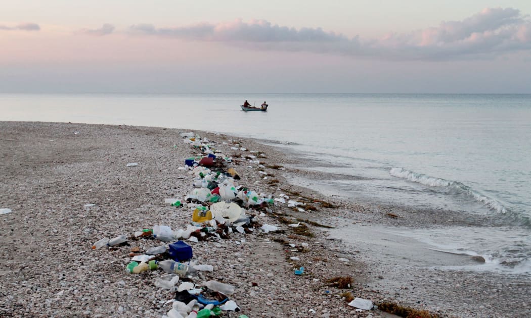 Plastic debris lines the coast in Haiti.