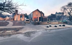 A house designed by architect Greg Chasen stands undamaged after a wildfire burned through the Palisades.