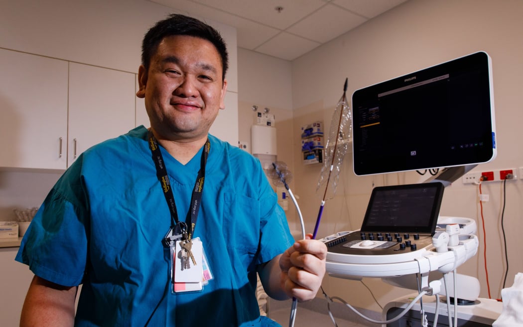 Dr Shueh Hao Lim with two of the ClotTriever devices