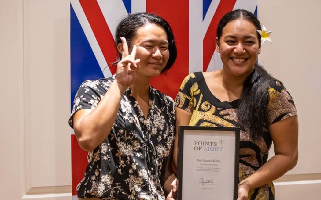 Jun Ho Gregory Kim and Fusi Masina Tietie who won the Commonwealth Point of Light award