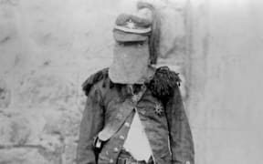 New Plymouth Highwayman Robert Wallath shortly after his arrest  1893 wearing his mask, army coat and plumed hat