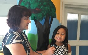 Mafi Manu, 7, in Auckland's Starship Children's Hospital for treatment with paediatrician Catherine Byrnes.