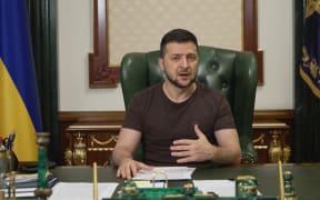 In this handout picture taken on 20 March 2022 and released by the Ukrainian Presidency Press Office, Ukrainian President Volodymyr Zelensky delivers a video address in Kyiv.