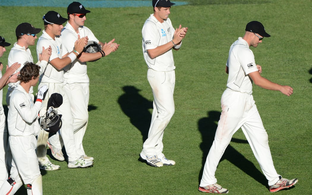 Peter Fulton leads the NZ team from the field after centuries in both innings on against England in 2013.