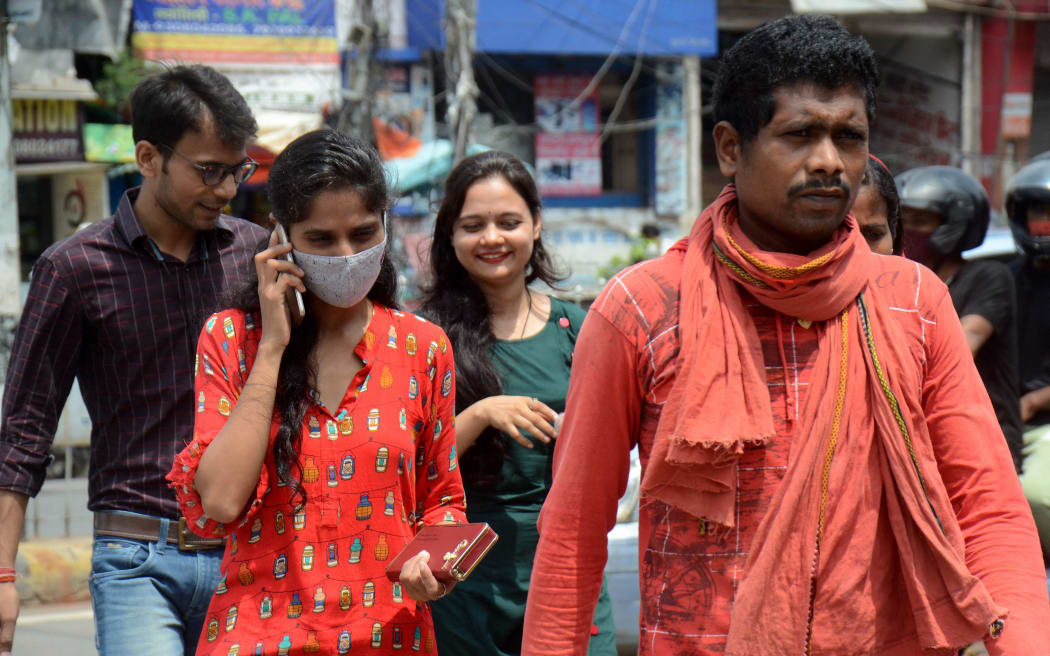 Some people seen without face mask moving on the road during Coronavirus situation in Patna, in India, on 9 July 2021.