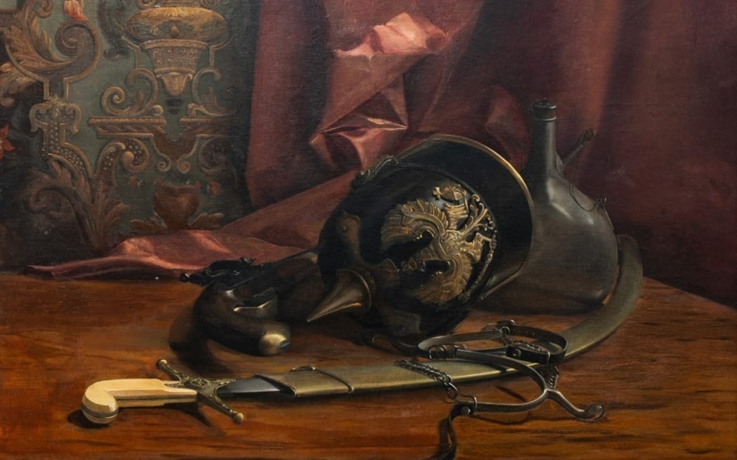 An oil painting of a military helmet, old flintlock holster pistol, spurs, scimitars in a brass case, and a water bottle. A red curtain is in the background with detailed wall decorations.