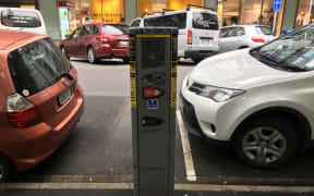 A file photo of someone paying for parking in Wellington's CBD