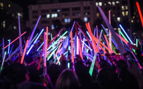 LOS ANGELES, CA - DECEMBER 18: Fans gather for the Star Wars Lightsaber Battle "The Light Battle Tour" at Pershing Square on December 18, 2015 in Los Angeles, California.