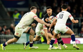 All Blacks first five-eighth Richie Mo'unga takes on England's defence during the 25-25 draw at Twickenham.