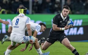 All Black Will Jordan attempts to evade Ross Vintcent of Italy during All Blacks v Italy.