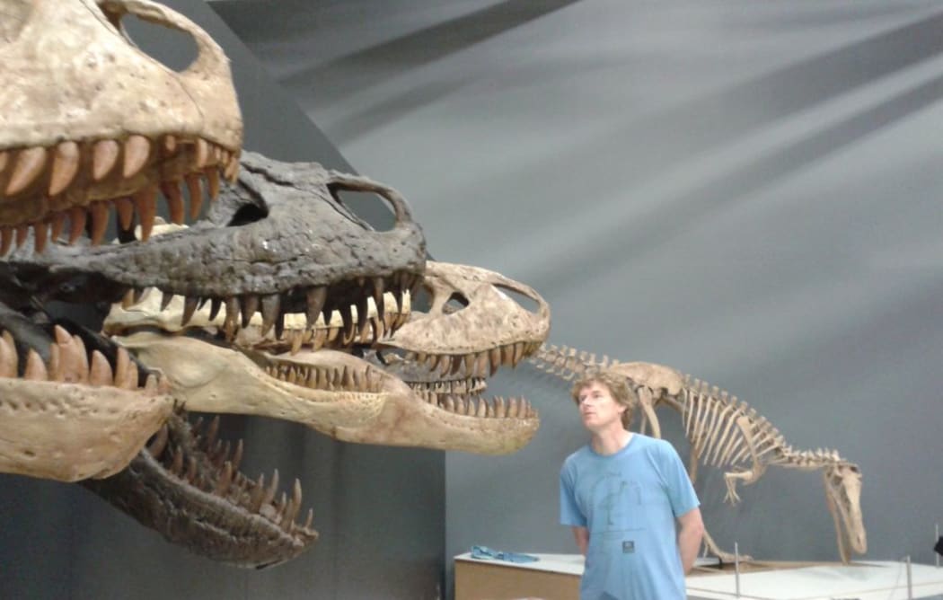 Te Papa curator Alan Tennyson with the skulls of several tyrannosaurs.