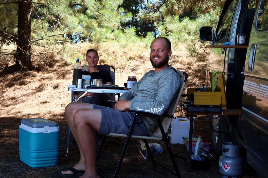 Queenstown residents Michel Nebel, front, and Rahel Haener heard the explosion before they saw the fire.