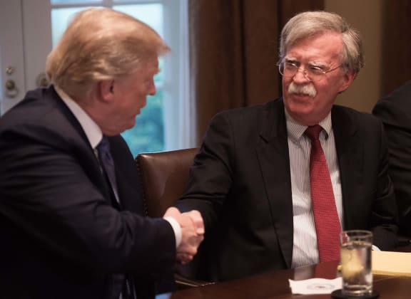 US President Donald Trump with National Security Advisor John Bolton during a meeting with senior military leaders at the White House in Washington, DC.in April 2018.