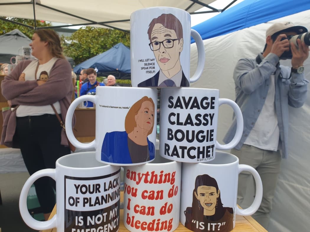 Mugs for sale at Smales Farm markets, including those featuring Director-General of Health Dr Ashley Bloomfield, National leader Judith Collins and Labour leader Jacinda Ardern.