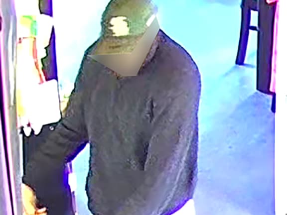 CCTV image of a man in relation to an ongoing homicide investigation in Northland. The images were edited by NZ Police around the man's face before publication by media.