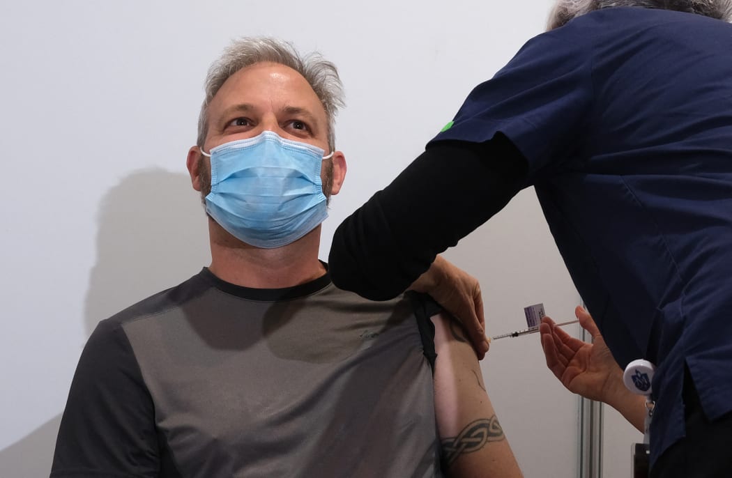 Victorian state chief health officer Brett Sutton receives the AstraZeneca Covid-19 vaccine in Melbourne on April 21, 2021