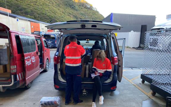 Lee (left) and Jan Pryor sorting mail for their shared route.