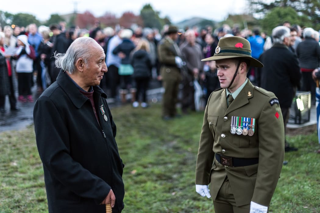 Participants share a moment following the dawn service at Tolaga Bay.
