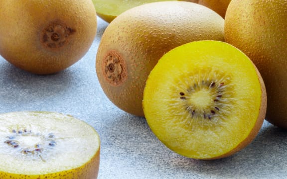 A stock photo of gold kiwifruit.