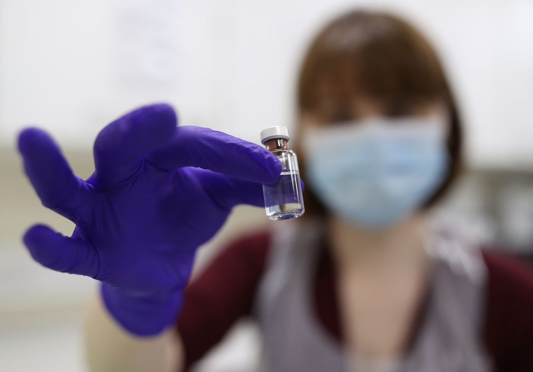 An NHS pharmacy technician holds a vial during a training session at the Royal Free Hospital in London ahead of the rollout of the Pfizer / BioNTech coronavirus vaccine in the UK.