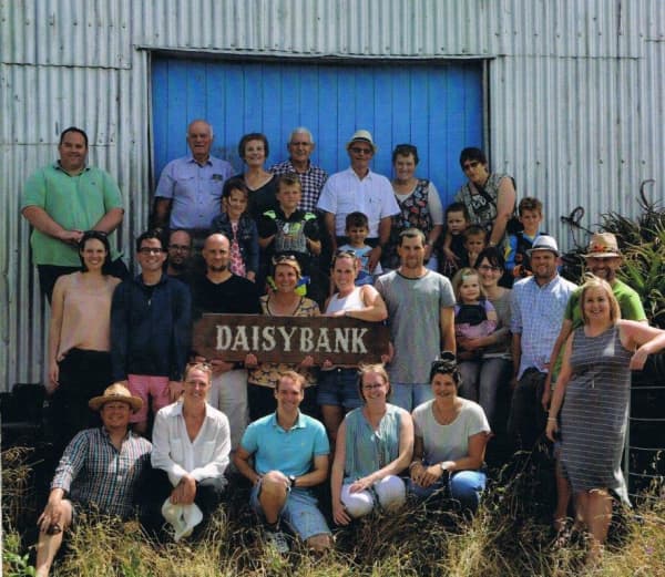 Several generations of Harvey family cousins gather together in front of the old woolshed at Daisybank farm.