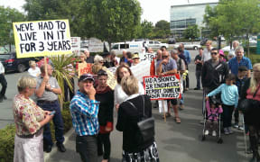 Protestors outside the Southern Response offices.