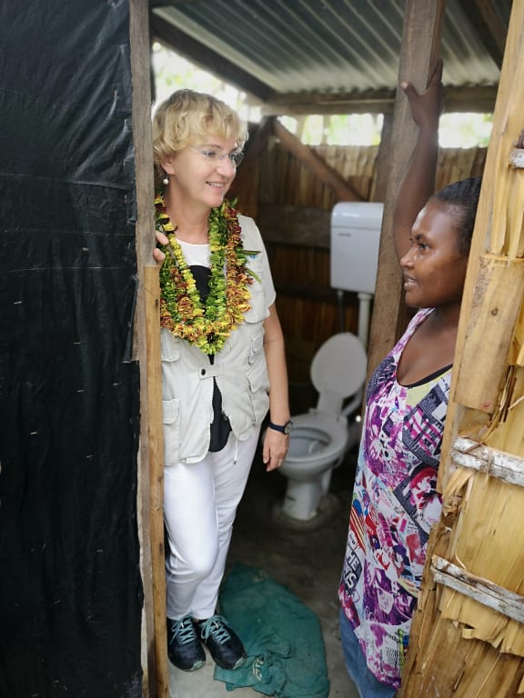 UNICEF Regional Director, Karin Hulshof in Walo community, North Malaita with a local woman.