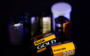 Two film rolls with the Kodak logo are in front of other photography film rolls. (Photo by Nikos Pekiaridis/NurPhoto) (Photo by Nikos Pekiaridis / NurPhoto via AFP)
