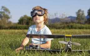Boy with toy plane