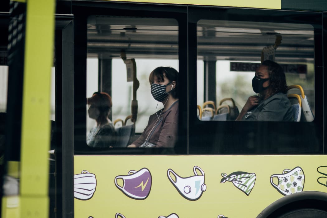 Bus passengers wearing masks during level 2, Wellington 15 February 2021