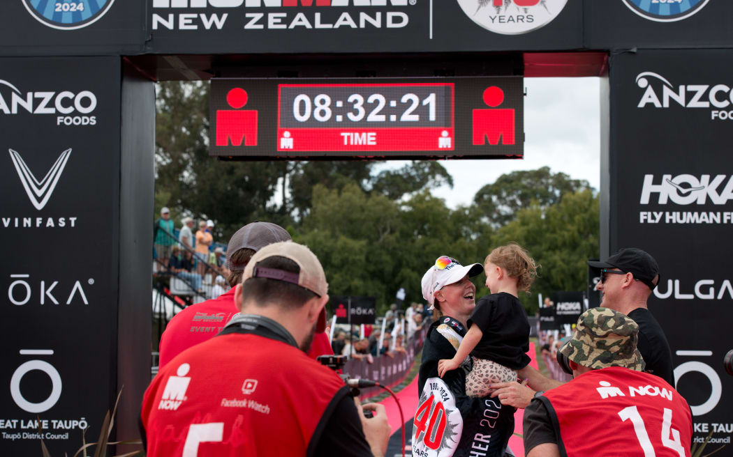 Chelsea Sodaro celebrates her first placing, at the Taupō Ironman.