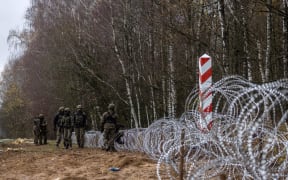 Polish soldiers build a fence on the Polish-Russian border in Kaliningrad Oblast region, Zerdziny, north-eastern Poland, on November 3, 2022.