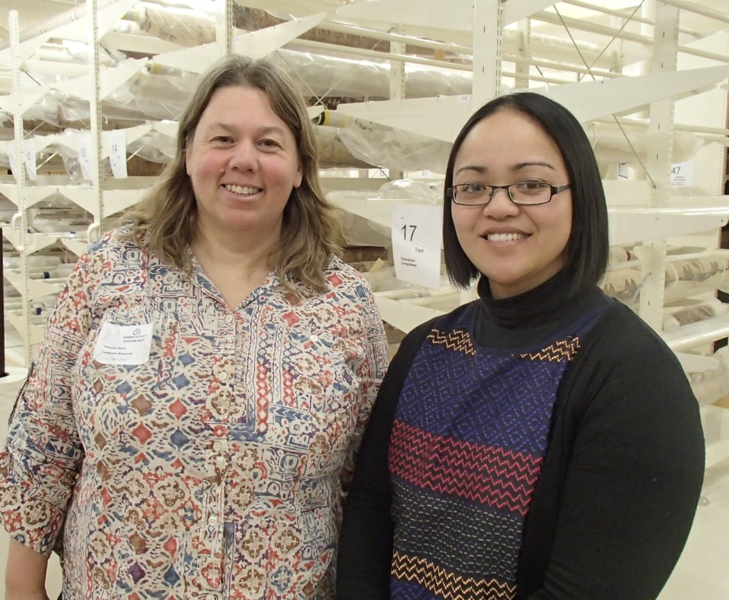 Cilla Wehi (left) and Migoto Eria in the textile store at Otago Museum.
