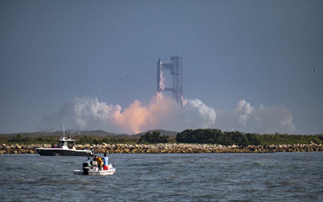 The SpaceX Starship rocket launches from Starbase, Texas, as seen from South Padre Island on May 27, 2025. SpaceX mission control lost contact with the upper stage of Starship as it leaked fuel, spun out of control, and made an uncontrolled reentry after flying halfway around the world, likely disintegrating over the Indian Ocean, officials said. (Photo by Sergio FLORES / AFP)