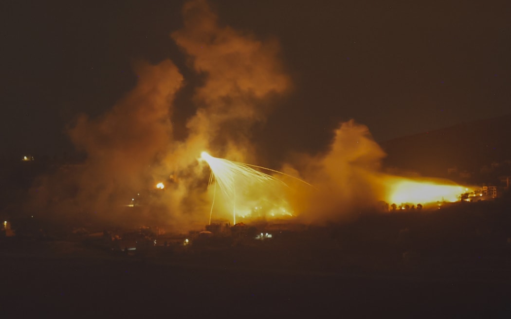 A picture taken from northern Israel, along the border with southern Lebanon, on September 30, 2024 shows a fire following Israeli bombardment on an area of south Lebanon. The Israeli military said Tuesday troops have started "targeted ground raids" in villages of southern Lebanon. The incursions backed by airstrikes and artillery began "a few hours ago" and are targeting militant group Hezbollah "in villages close to the border" with Israel, a military statement said. (Photo by Jalaa MAREY / AFP)