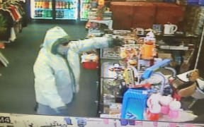 An image of the robbery taken from CCTV footage.