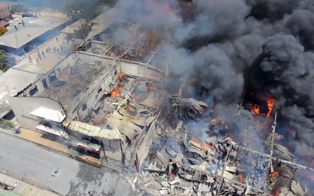 A drone photo shows the extend of the damage caused by the blaze that destroyed two major businesses and many houses around them on June 6. Photo: Kwajalein Atoll Development Authority.