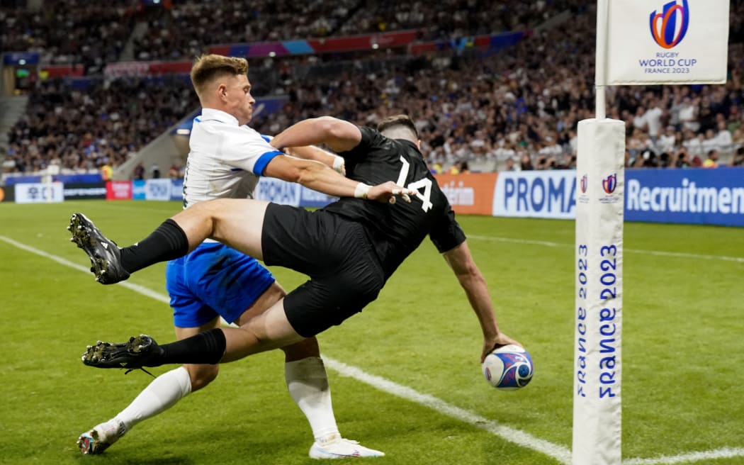 Will Jordan scores his side's first try during their Rugby World Cup against Italy at the OL Stadium near Lyon.