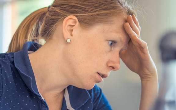 tired woman at computer