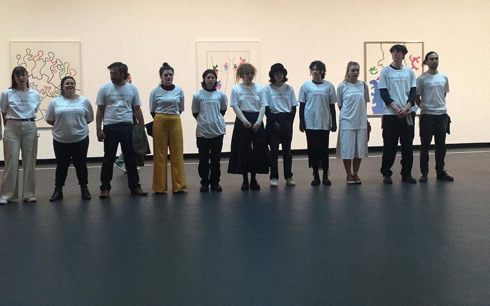 Students protest a Theo Schoon exhibition at Wellington City Council.