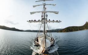 The Spirit of Adventure ship with trainees on the sails.