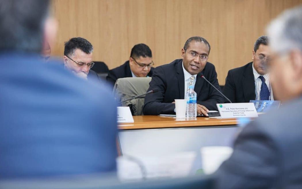 Peter Kenny Loria Jr. (center)