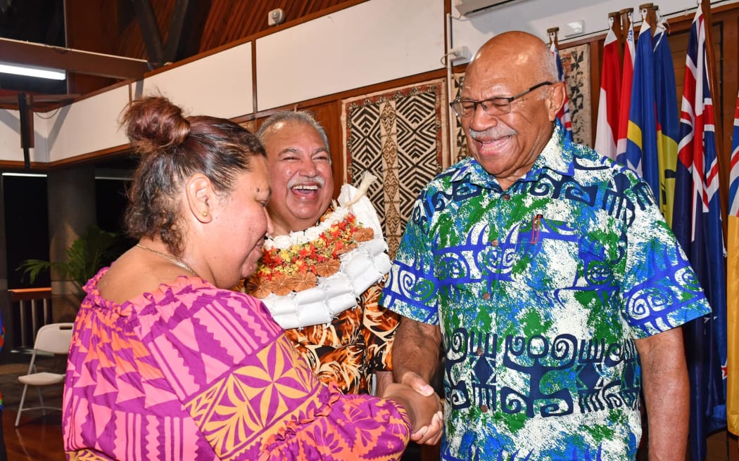 Waqa, center, was during a special traditional ceremony at the Forum Secretariat on Thursday by Rabuka, right.