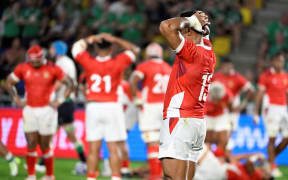 Tonga's centre Malakai Fekitoa (right) reacts at the end of the 2023 Rugby World Cup Pool B match between Ireland and Tonga at the Stade de la Beaujoire in Nantes, western France on September 16, 2023.