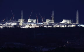 Fukushima Daiichi nuclear power plant  lit up in Okuma.