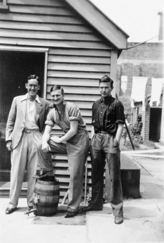 Ian Frank George Milner, Denis Glover and Robert William Lowry outside St Elmo flats, Christchurch.