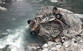Part of the couple's vehicle found in the Haast River.