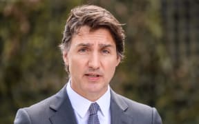 Canada's Prime Minister Justin Trudeau addresses a joint press conference with the Latvian Prime Minister (not in picture) at the Adazi military base in Riga, Latvia, where they visited the Canada-led multinational NATO enhanced Forward Presence Battle Group, on July 10, 2023.